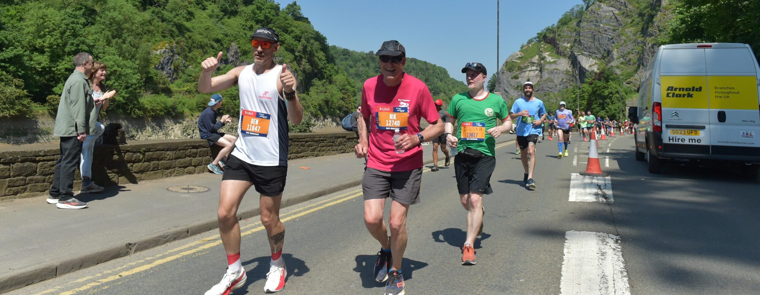 Runners in the Bristol Half Marathon underneath the Clifton Suspension Bridge.